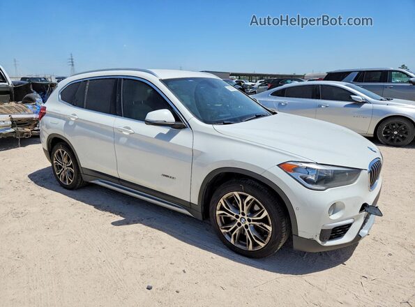 WBXHT3C33G5F67372 2016 BMW X1 White Front right