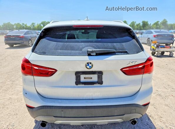WBXHT3C33G5F67372 2016 BMW X1 White Rear view