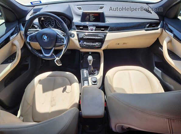 WBXHT3C33G5F67372 2016 BMW X1 White Dashboard view