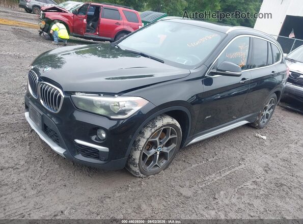 WBXHT3C38G5E53092 2016 BMW X1 Black წინა მარცხენა ხედი სამი მეოთხედიდან
