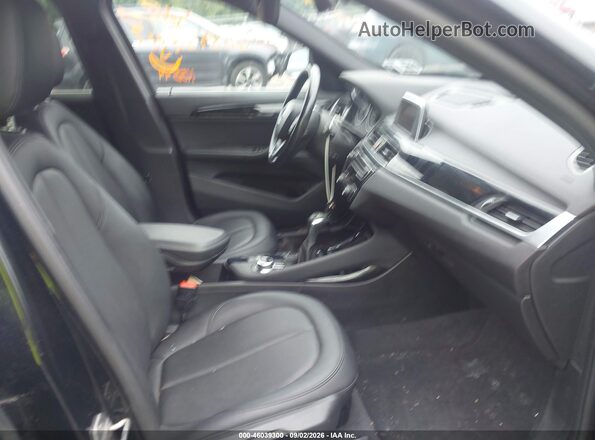 WBXHT3C38G5E53092 2016 BMW X1 Black წინა სალონის ხედი