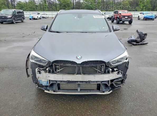 WBXHT3C38G5F64094 2016 BMW X1 Gray Front view