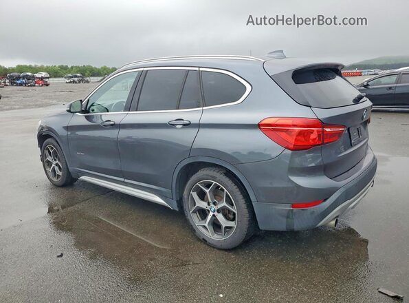 WBXHT3C38G5F64094 2016 BMW X1 Gray Rear left