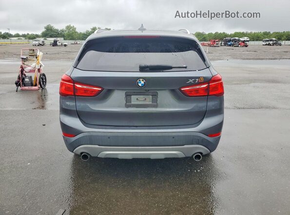 WBXHT3C38G5F64094 2016 BMW X1 Gray Rear view