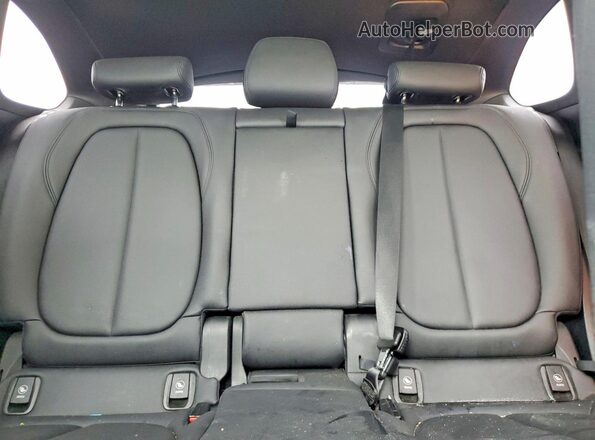 WBXHT3C38G5F64094 2016 BMW X1 Gray Rear seats view
