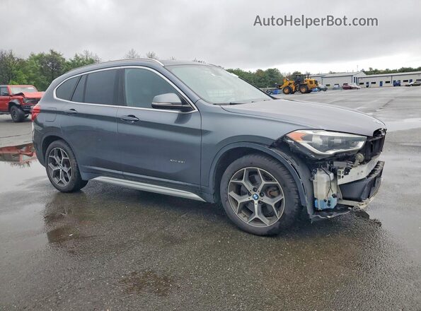WBXHT3C38G5F64094 2016 BMW X1 Gray Front right