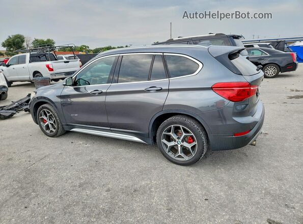 WBXHT3C38H5F81981 2017 BMW X1 Gray Rear left