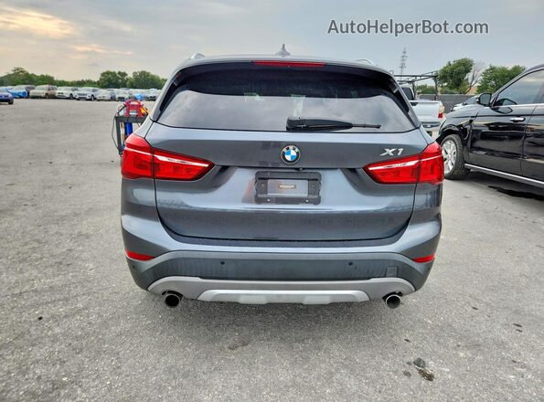 WBXHT3C38H5F81981 2017 BMW X1 Gray Rear view