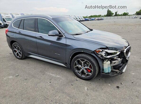 WBXHT3C38H5F81981 2017 BMW X1 Gray Front right