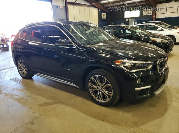 WBXHT3C39H5F67765 2017 BMW X1 Black Передня права чверть