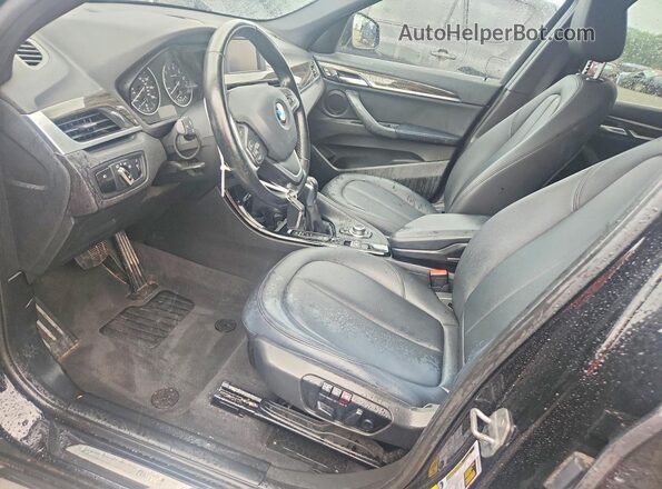 WBXHT3C3XGP881165 2016 BMW X1 Black Widok wnętrza z przodu