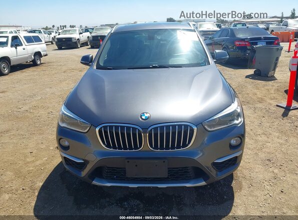 WBXHT3Z32G4A49895 2016 BMW X1 Gray ხელსაწყოთა პანელის ხედი