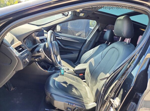WBXHT3Z37G4A49648 2016 BMW X1 Black Вид салону спереду