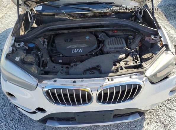 WBXHU7C32J5L07585 2018 BMW X1 White Engine compartment view