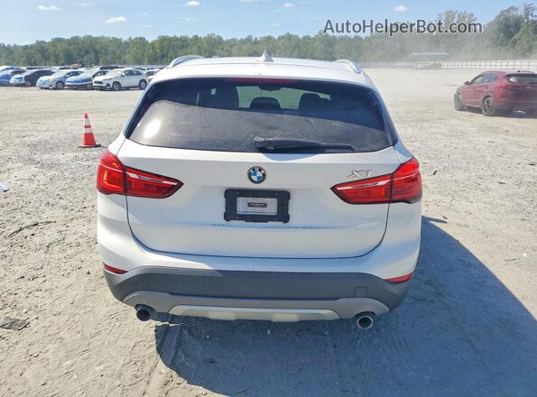 WBXHU7C35H5H37592 2017 BMW X1 White Rear view