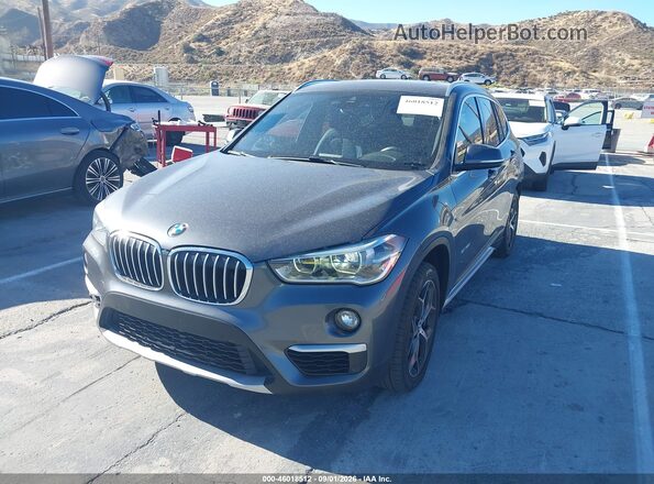 WBXHU7C38H5H33892 2017 BMW X1 Gray Առջևի ձախ երեք քառորդ տեսարան