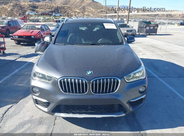 WBXHU7C38H5H33892 2017 BMW X1 Gray Սալոնի հետևի տեսք