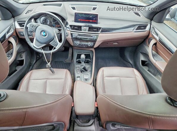 WBXHU7C39J3F04350 2018 BMW X1 Silver Dashboard view