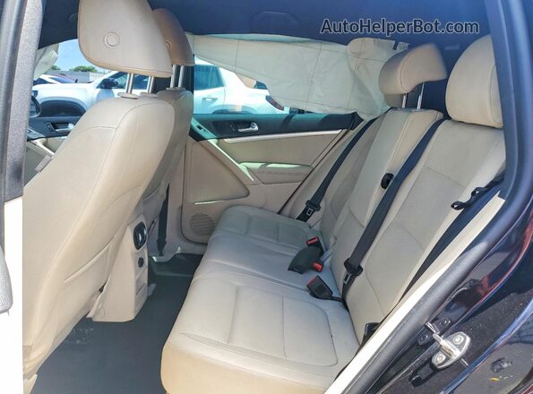 WVGAV7AX5GW021519 2016 VOLKSWAGEN TIGUAN Black Vista interior trasera
